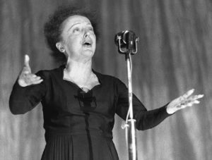 (FILES) File picture of late world-known French singer Edith Piaf performing at the Olympia concert hall 30 December 1960 in Paris. According to an opinion poll carried out by CSA for the Parisian daily Le Parisien and Channel Five (La Cinquieme), Piaf has been named as the " Singer of the Century" for French people. Famed for her renditions of " Non, je ne regrette rien " and " Mon legionnaire ", Piaf won with a landslide 54 percent, well ahead of Celine Dion with 26 percent and Maria Callas with 19 percent.